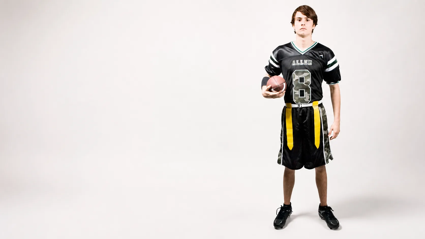 Flag football player in a custom Allen Sportswear uniform