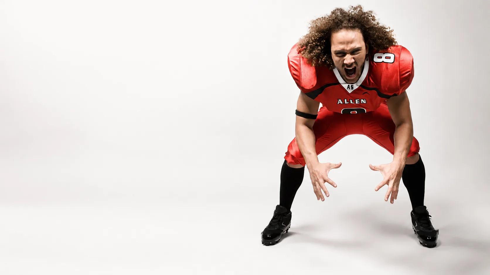 Football player in a custom Allen Sportswear uniform