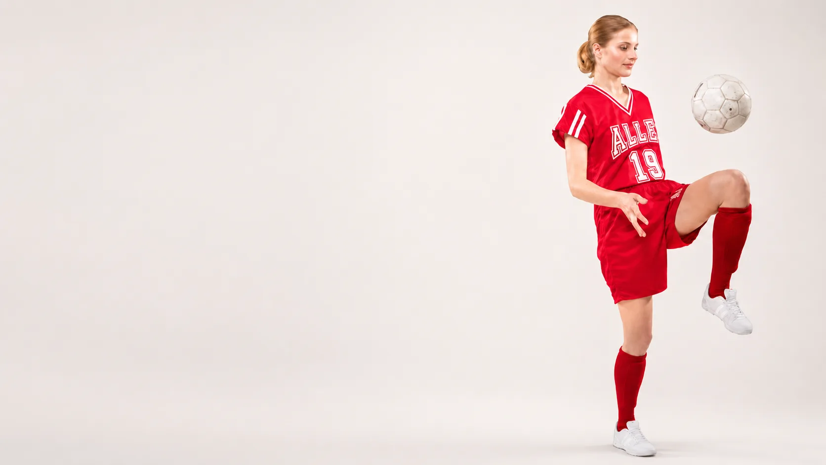 Soccer player in a custom Allen Sportswear uniform